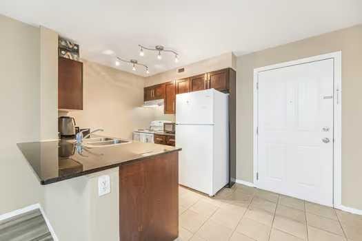 215-355 Taralake Way Ne, Calgary, AB - Indoor Photo Showing Kitchen With Double Sink