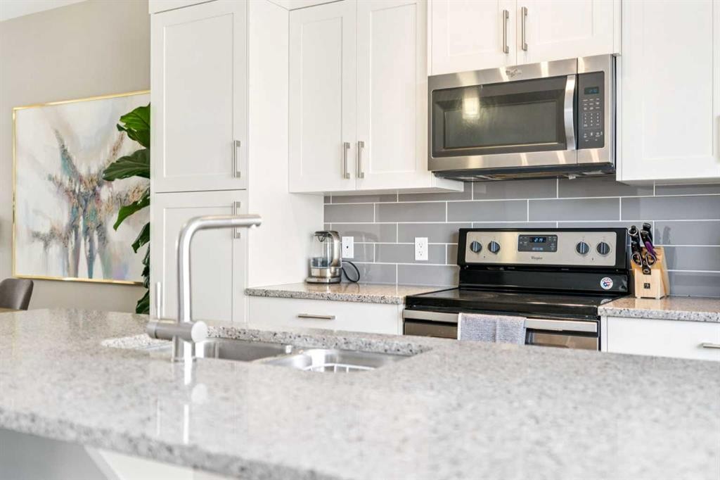 645 Evanston Manor Nw, Calgary, AB - Indoor Photo Showing Kitchen With Stainless Steel Kitchen With Upgraded Kitchen