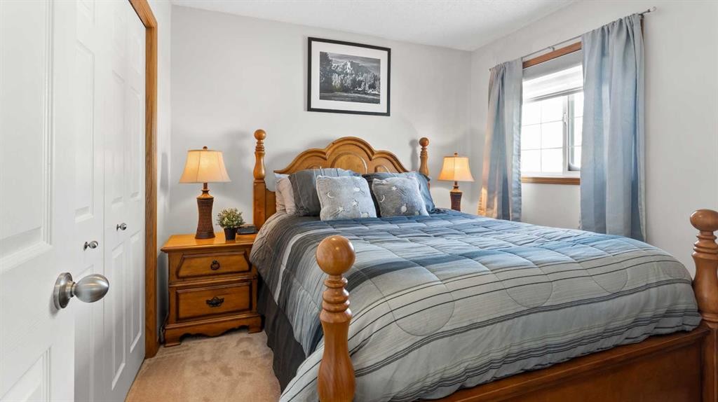323 Mt Cornwall Circle Se, Calgary, AB - Indoor Photo Showing Bedroom