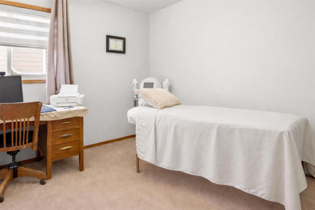 323 Mt Cornwall Circle Se, Calgary, AB - Indoor Photo Showing Bedroom