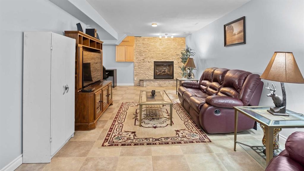 323 Mt Cornwall Circle Se, Calgary, AB - Indoor Photo Showing Other Room With Fireplace