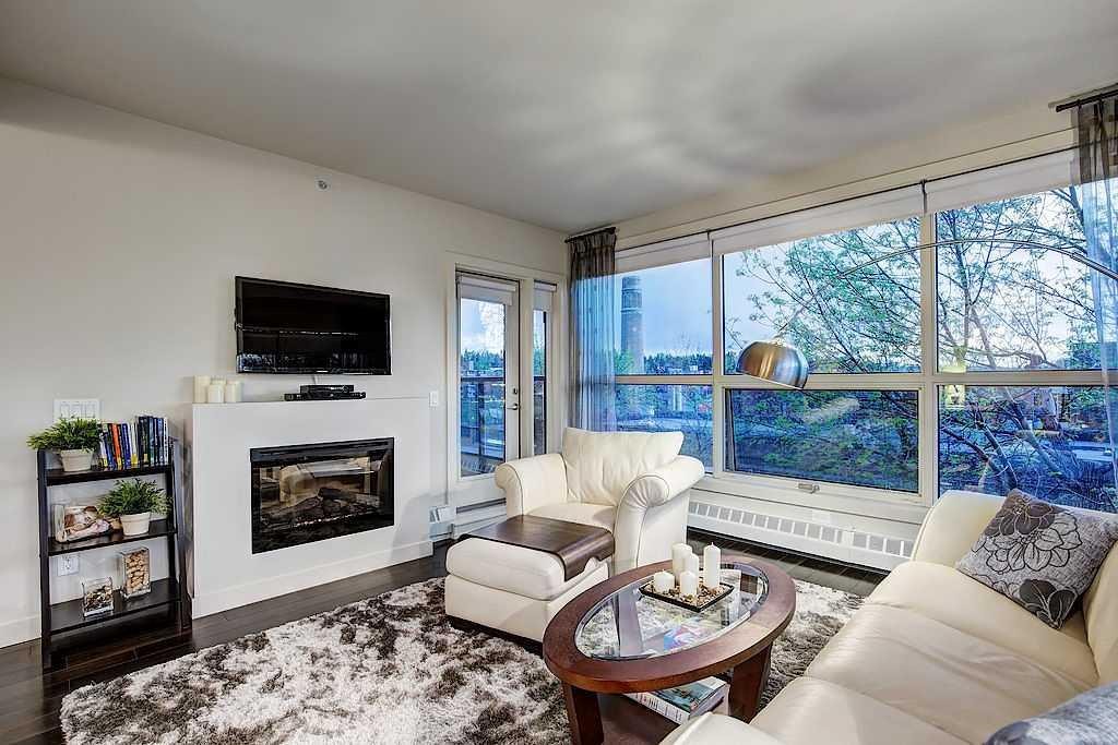 402-1730 5A Street Sw, Calgary, AB - Indoor Photo Showing Living Room With Fireplace