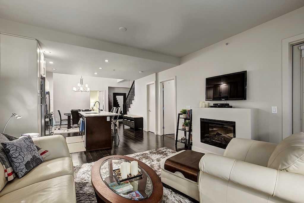402-1730 5A Street Sw, Calgary, AB - Indoor Photo Showing Living Room With Fireplace