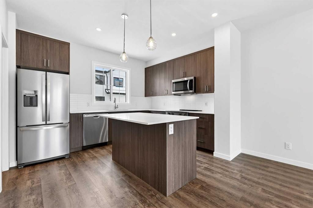 120-1750 Rangeview Drive Se, Calgary, AB - Indoor Photo Showing Kitchen With Stainless Steel Kitchen With Upgraded Kitchen