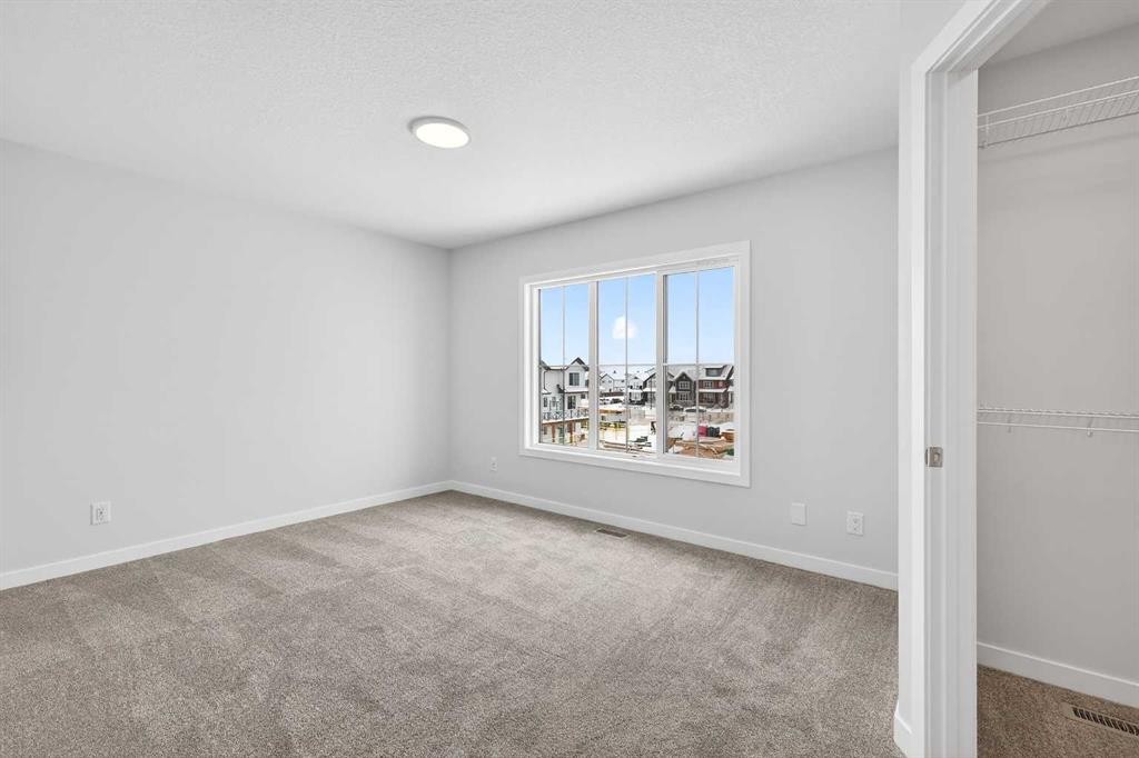120-1750 Rangeview Drive Se, Calgary, AB - Indoor Photo Showing Other Room