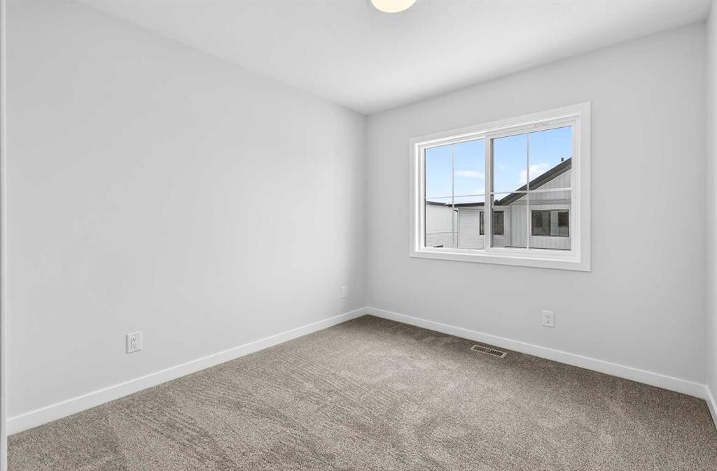 120-1750 Rangeview Drive Se, Calgary, AB - Indoor Photo Showing Other Room