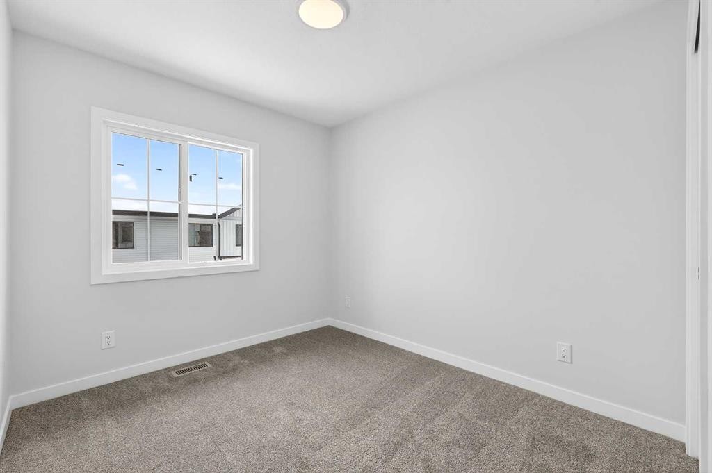120-1750 Rangeview Drive Se, Calgary, AB - Indoor Photo Showing Other Room