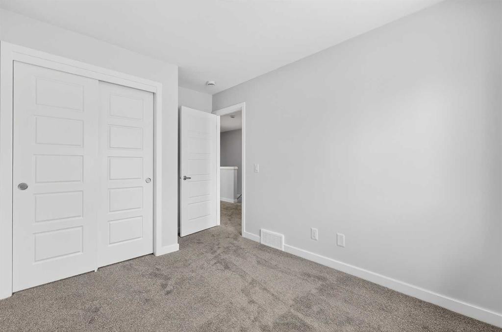 120-1750 Rangeview Drive Se, Calgary, AB - Indoor Photo Showing Other Room