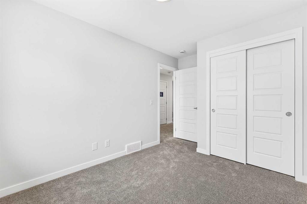117-1750 Rangeview Drive Se, Calgary, AB - Indoor Photo Showing Other Room