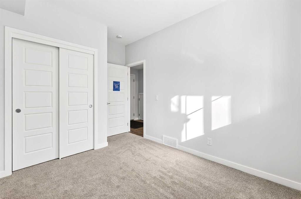 117-1750 Rangeview Drive Se, Calgary, AB - Indoor Photo Showing Other Room