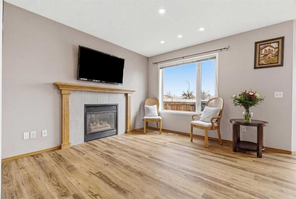 105 Douglas Ridge Circle Se, Calgary, AB - Indoor Photo Showing Living Room With Fireplace