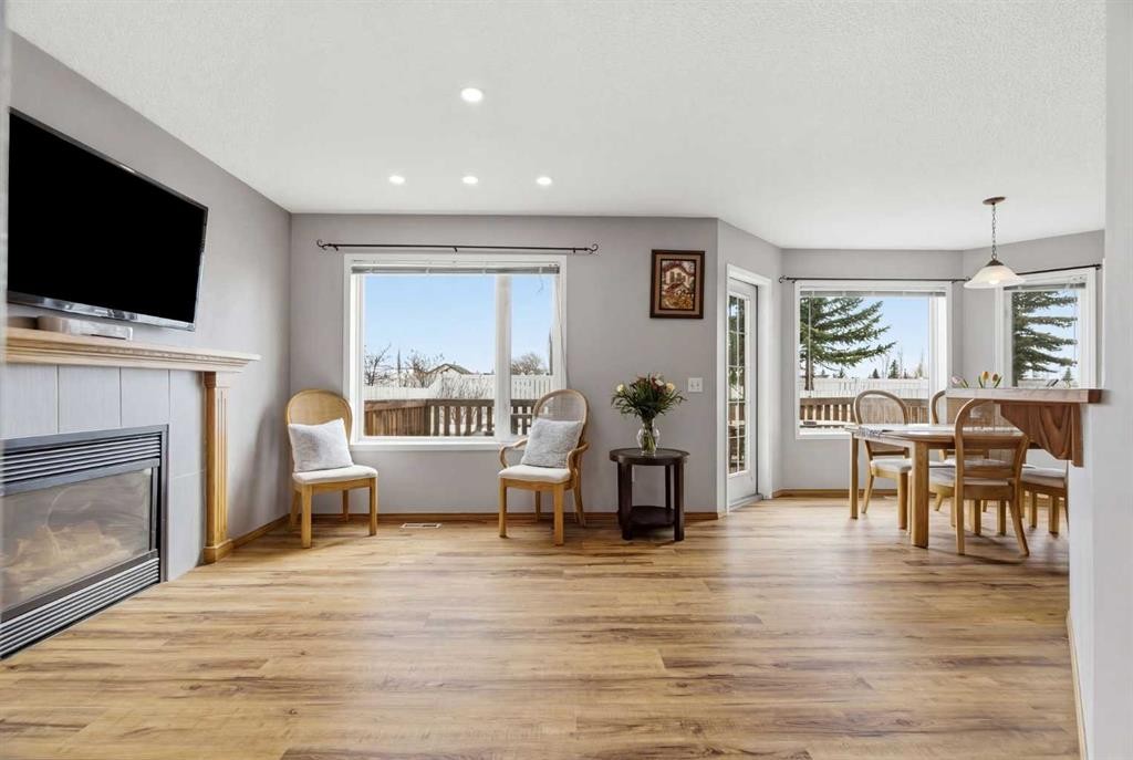 105 Douglas Ridge Circle Se, Calgary, AB - Indoor Photo Showing Living Room With Fireplace