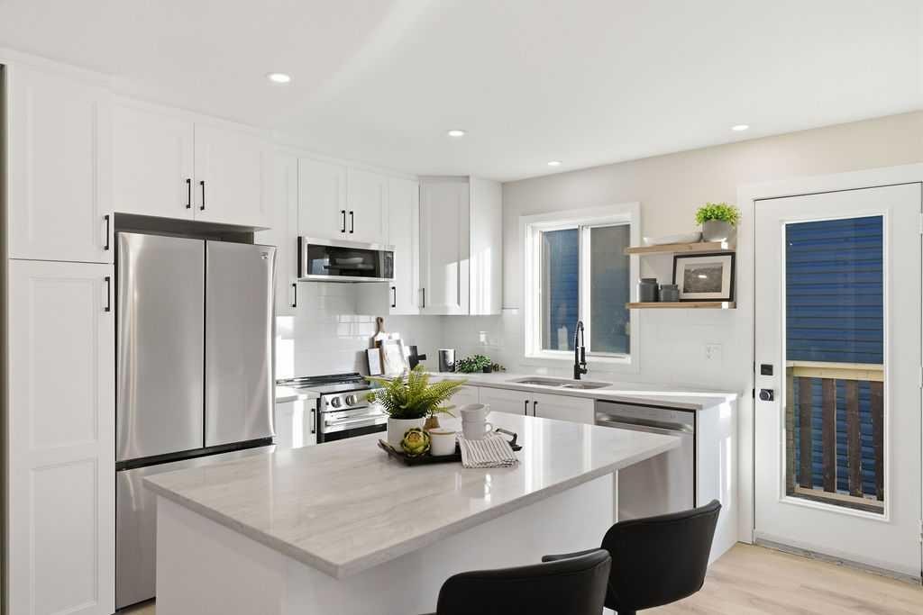 129 Coventry Place Ne, Calgary, AB - Indoor Photo Showing Kitchen With Double Sink With Upgraded Kitchen