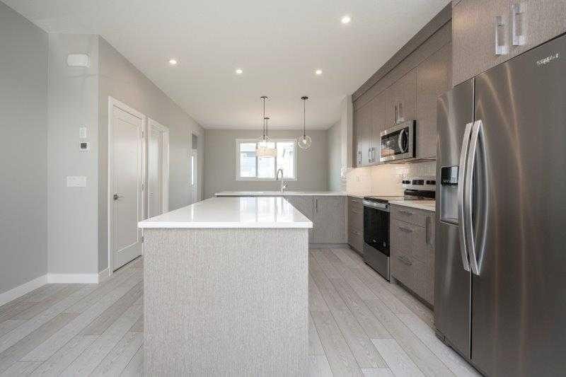 141 Dawson Wharf View, Chestermere, AB - Indoor Photo Showing Kitchen With Upgraded Kitchen
