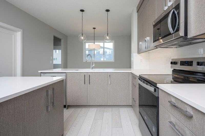 141 Dawson Wharf View, Chestermere, AB - Indoor Photo Showing Kitchen With Upgraded Kitchen