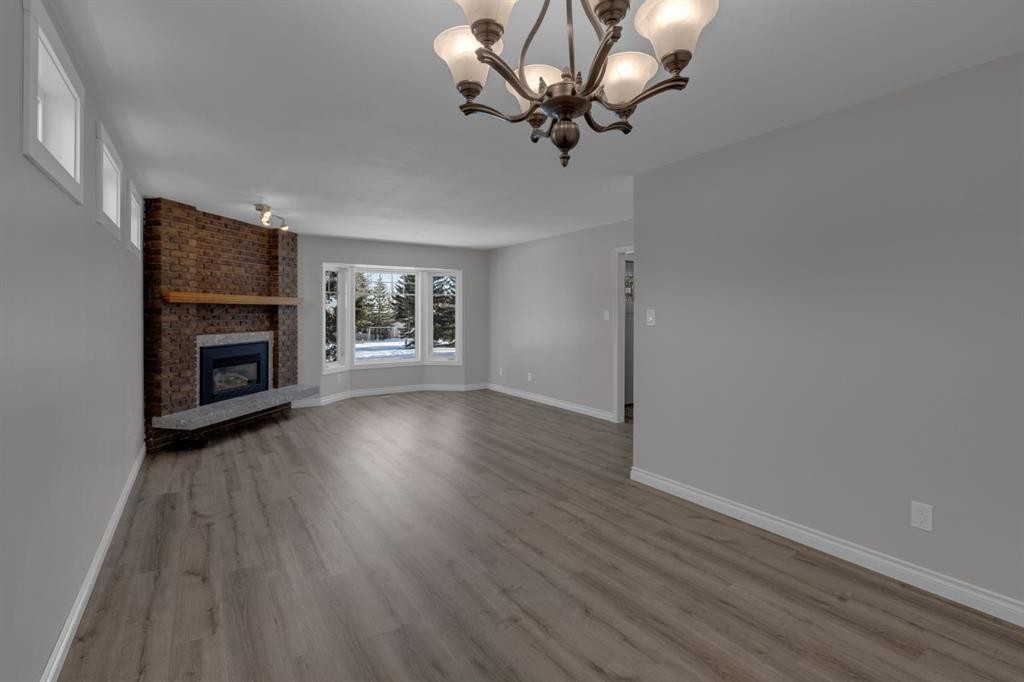 27 Berwick Place Nw, Calgary, AB - Indoor Photo Showing Other Room With Fireplace