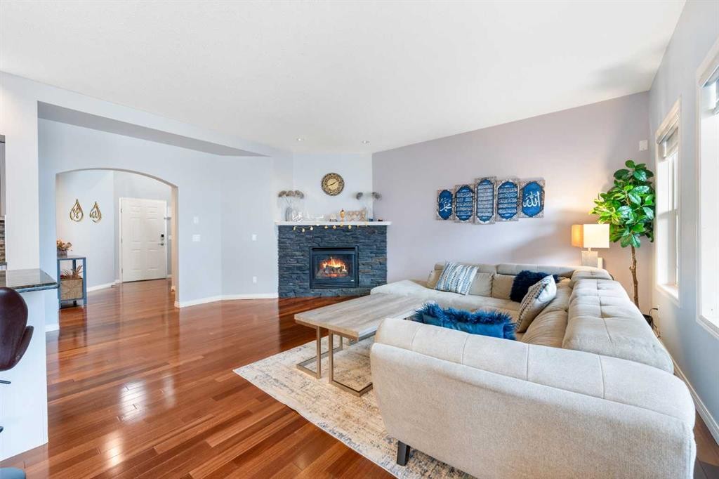 72 Panamount Heights Nw, Calgary, AB - Indoor Photo Showing Living Room With Fireplace
