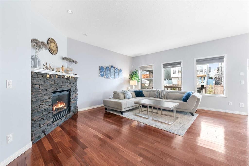 72 Panamount Heights Nw, Calgary, AB - Indoor Photo Showing Living Room With Fireplace