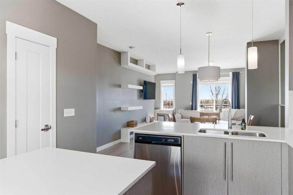 33-111 Rainbow Falls Gate, Chestermere, AB - Indoor Photo Showing Kitchen With Double Sink