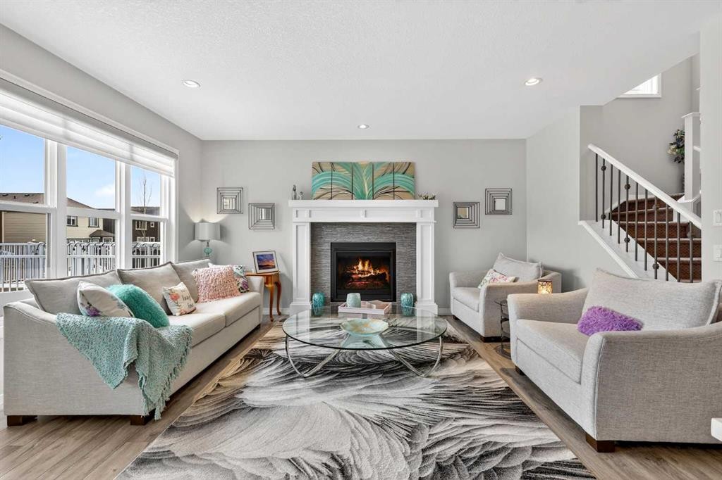 142 Masters Common Se, Calgary, AB - Indoor Photo Showing Living Room With Fireplace