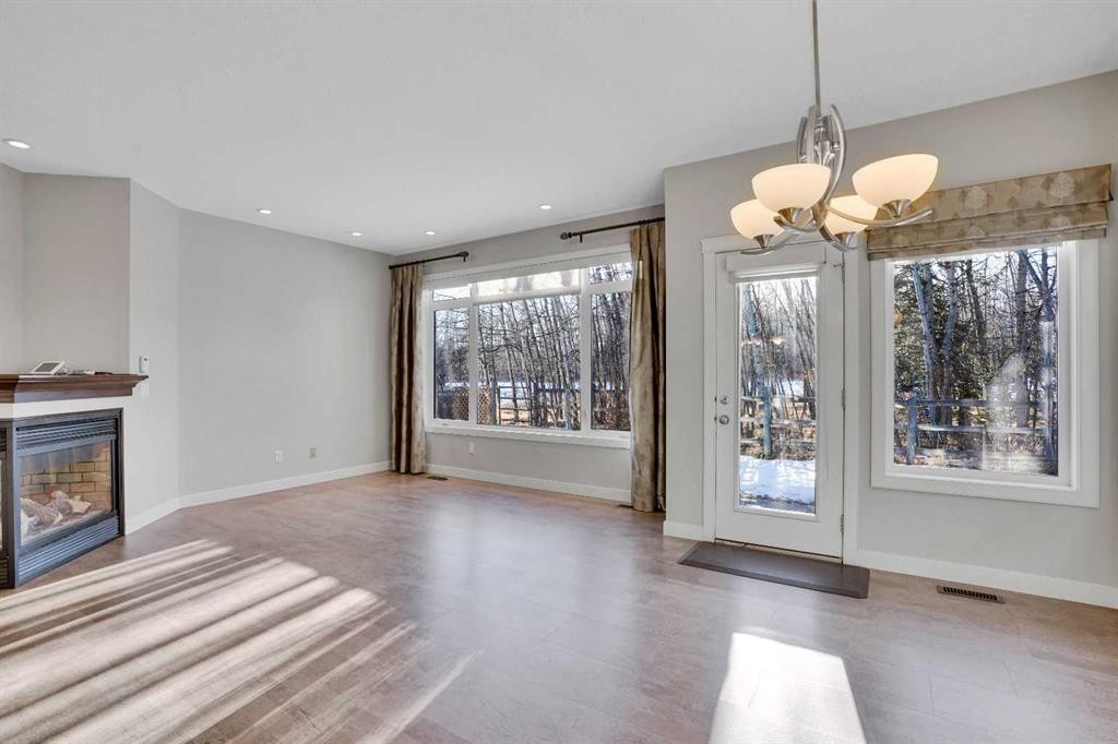 27-925 Imperial Drive, Diamond Valley, AB - Indoor Photo Showing Living Room With Fireplace