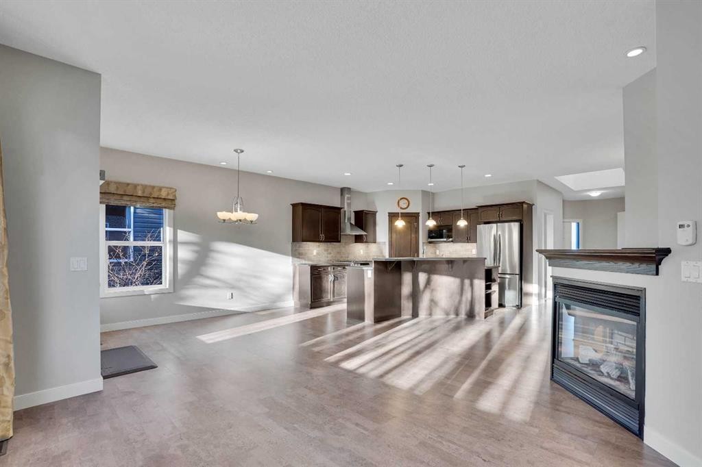 27-925 Imperial Drive, Diamond Valley, AB - Indoor With Fireplace
