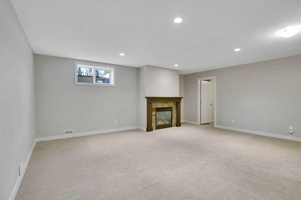 27-925 Imperial Drive, Diamond Valley, AB - Indoor With Fireplace
