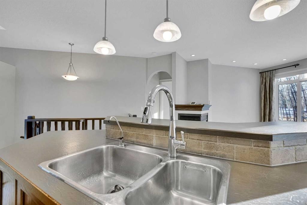 27-925 Imperial Drive, Diamond Valley, AB - Indoor Photo Showing Kitchen With Double Sink