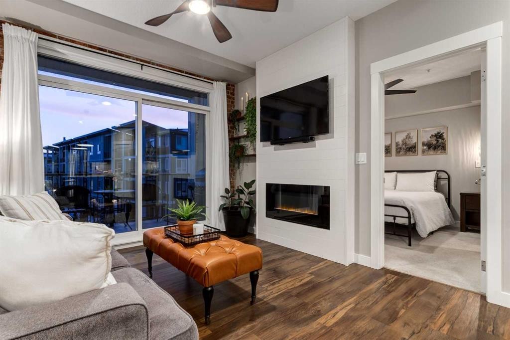 312-10 Walgrove Walk Se, Calgary, AB - Indoor Photo Showing Living Room With Fireplace