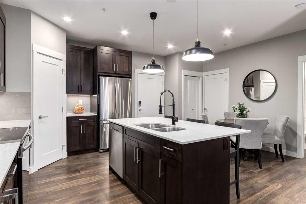 312-10 Walgrove Walk Se, Calgary, AB - Indoor Photo Showing Kitchen With Double Sink With Upgraded Kitchen