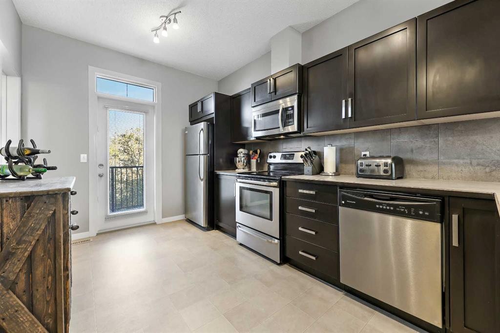 68 New Brighton Point Se, Calgary, AB - Indoor Photo Showing Kitchen With Stainless Steel Kitchen