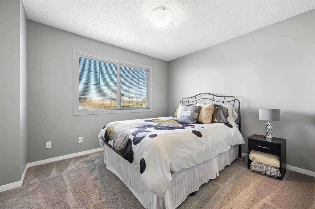 68 New Brighton Point Se, Calgary, AB - Indoor Photo Showing Bedroom