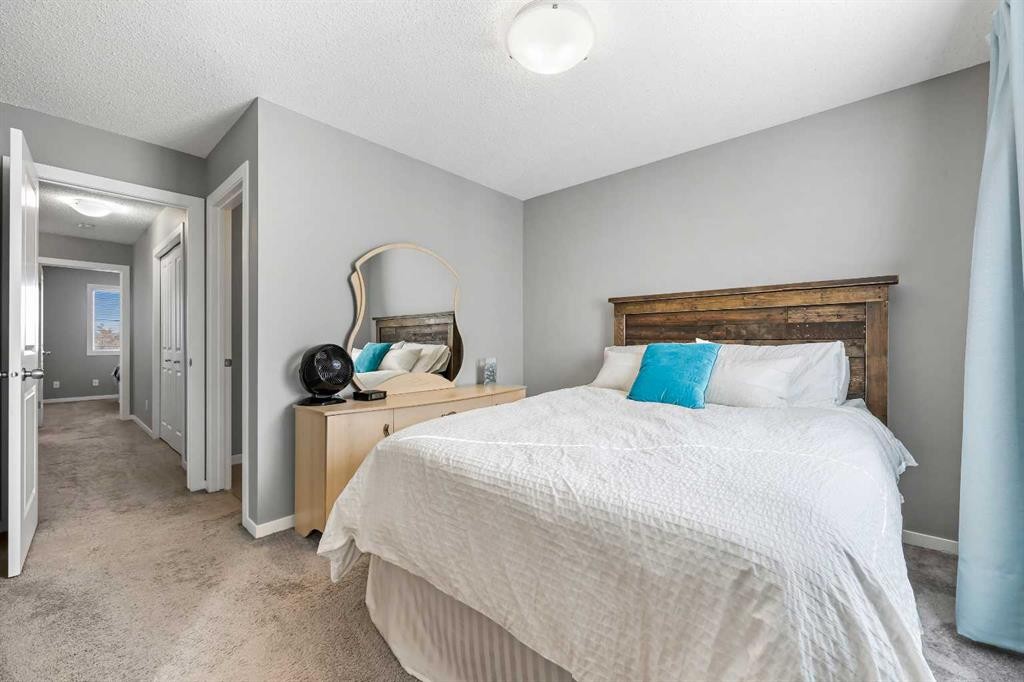 68 New Brighton Point Se, Calgary, AB - Indoor Photo Showing Bedroom