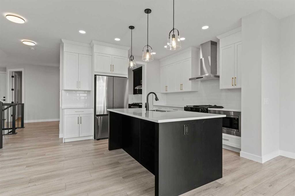 302 Kinniburgh Loop, Chestermere, AB - Indoor Photo Showing Kitchen With Upgraded Kitchen