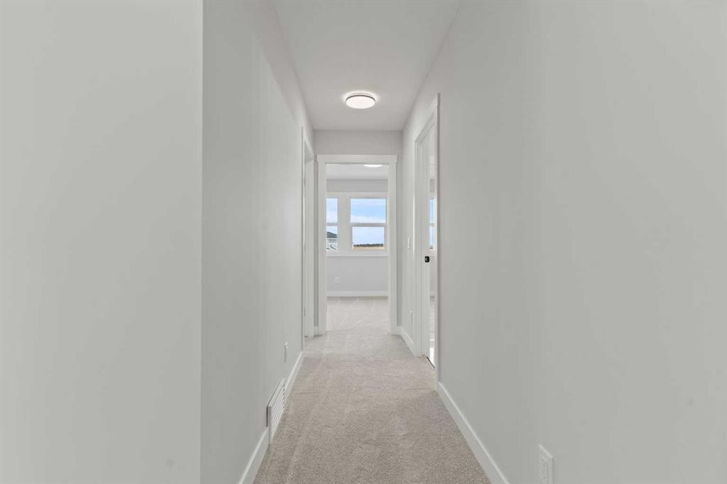 302 Kinniburgh Loop, Chestermere, AB - Indoor Photo Showing Other Room