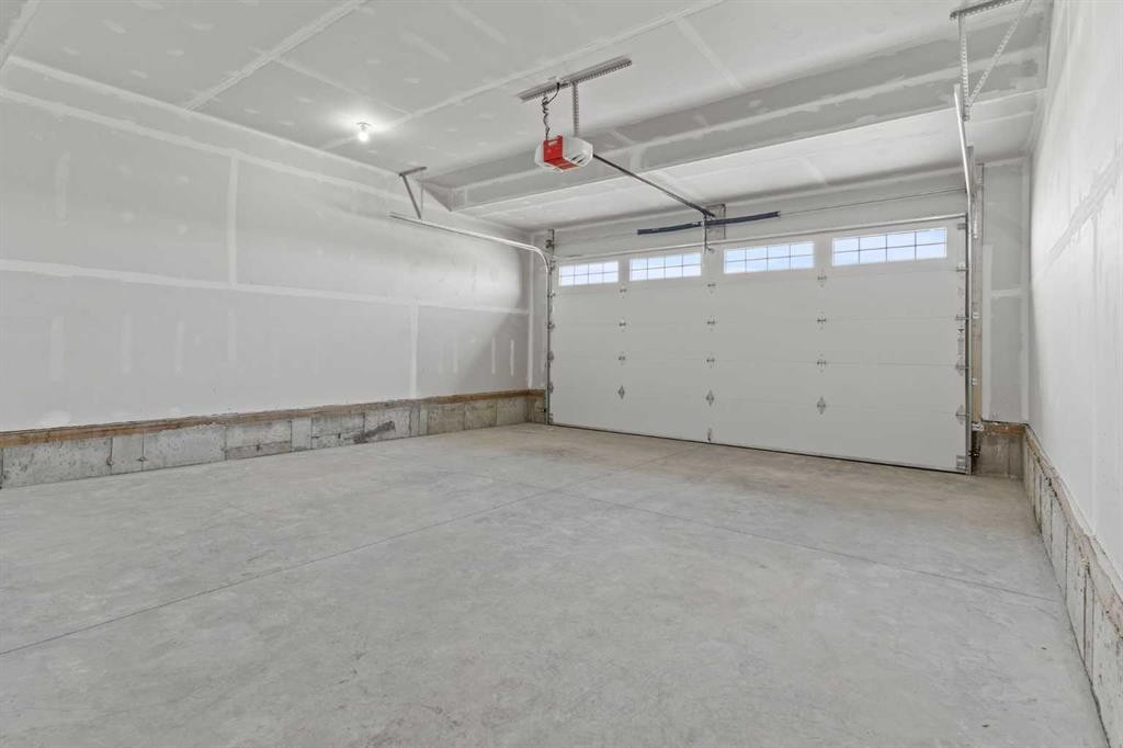 302 Kinniburgh Loop, Chestermere, AB - Indoor Photo Showing Garage