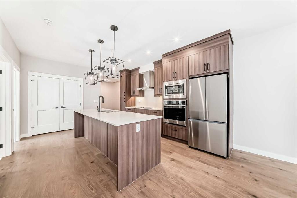 7121-1802 Mahogany Boulevard Se, Calgary, AB - Indoor Photo Showing Kitchen With Stainless Steel Kitchen