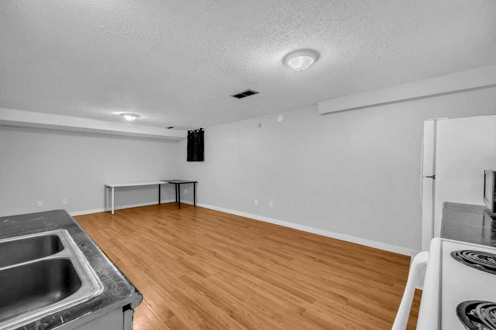 1140 Abbeydale Drive Ne, Calgary, AB - Indoor Photo Showing Kitchen With Double Sink