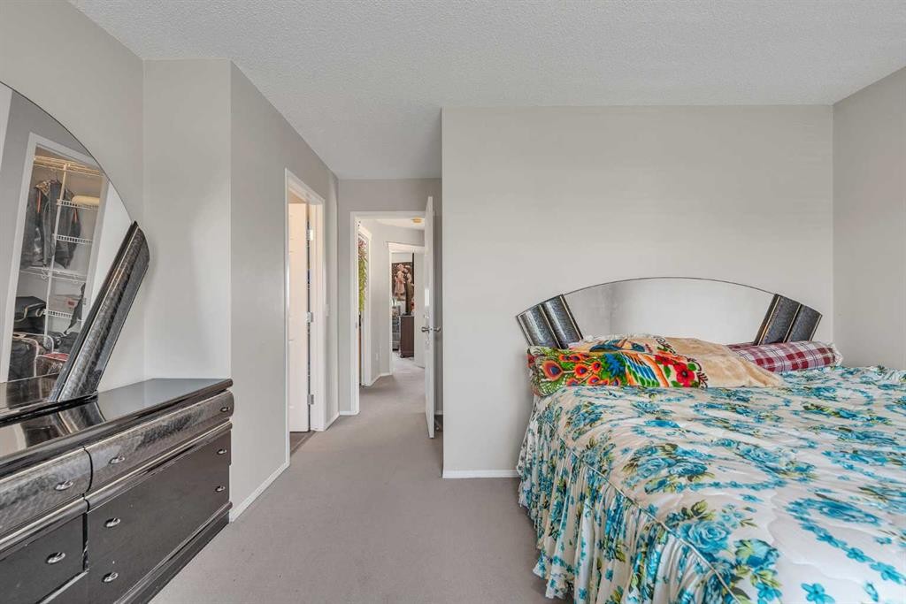 115 Evermeadow Avenue Sw, Calgary, AB - Indoor Photo Showing Bedroom