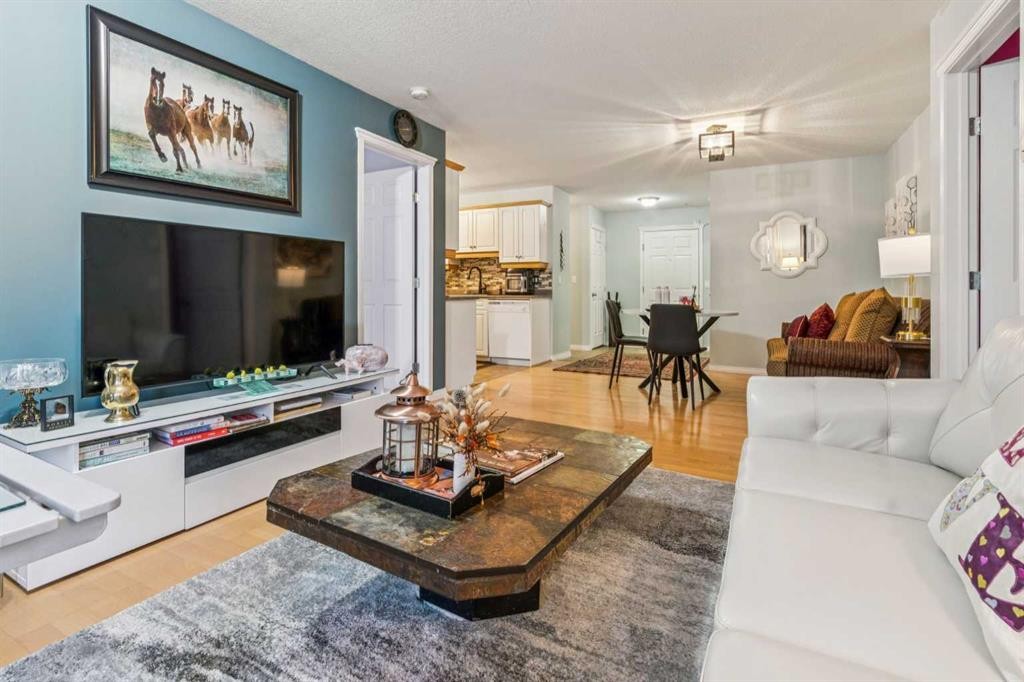 105-15320 Bannister Road Se, Calgary, AB - Indoor Photo Showing Living Room