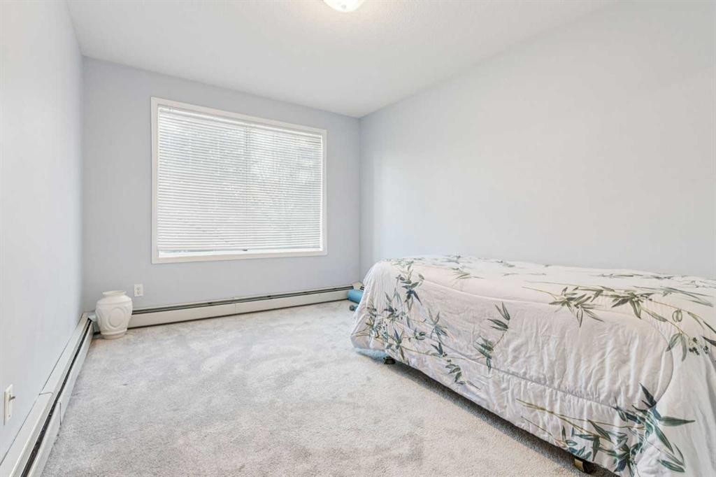 105-15320 Bannister Road Se, Calgary, AB - Indoor Photo Showing Bedroom