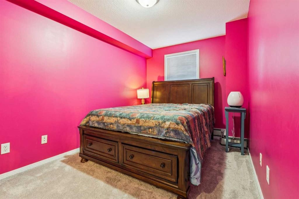 105-15320 Bannister Road Se, Calgary, AB - Indoor Photo Showing Bedroom