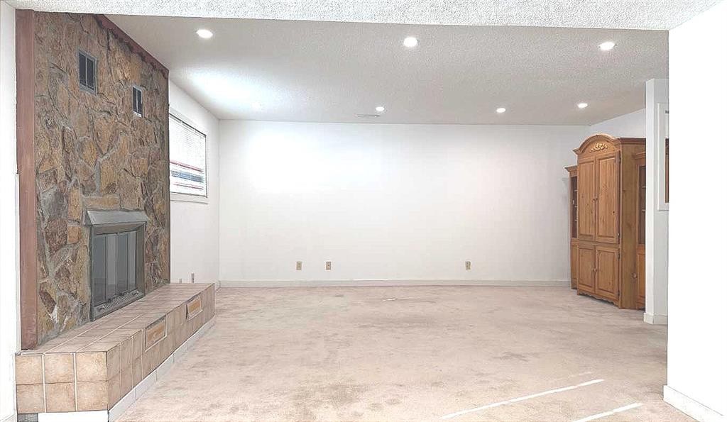 6715 43 Avenue Ne, Calgary, AB - Indoor Photo Showing Other Room With Fireplace
