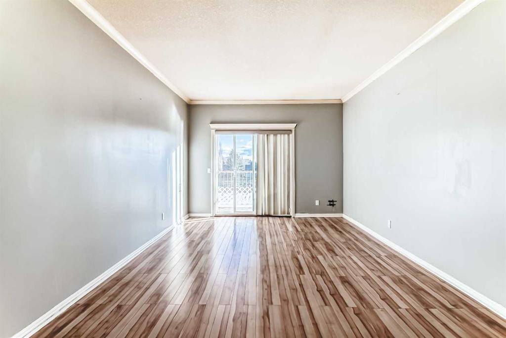 205-7 Lineham Avenue, Okotoks, AB - Indoor Photo Showing Other Room