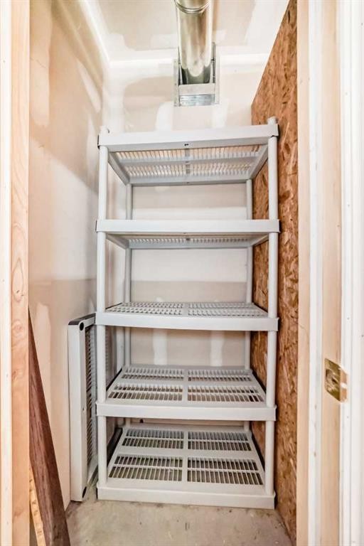 205-7 Lineham Avenue, Okotoks, AB - Indoor With Storage