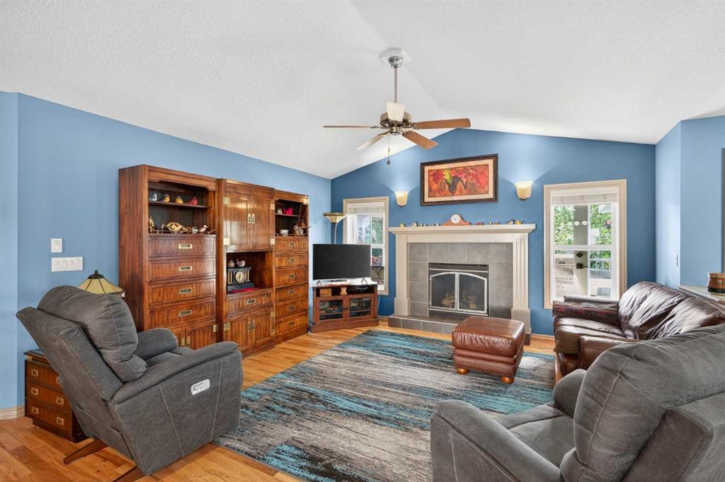 125 Copeland Close, Langdon, AB - Indoor Photo Showing Living Room With Fireplace
