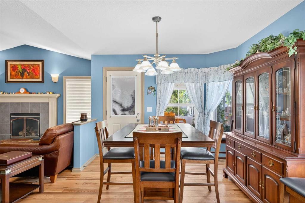 125 Copeland Close, Langdon, AB - Indoor Photo Showing Dining Room With Fireplace
