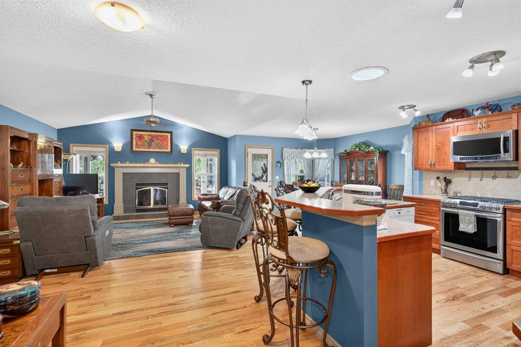 125 Copeland Close, Langdon, AB - Indoor With Fireplace