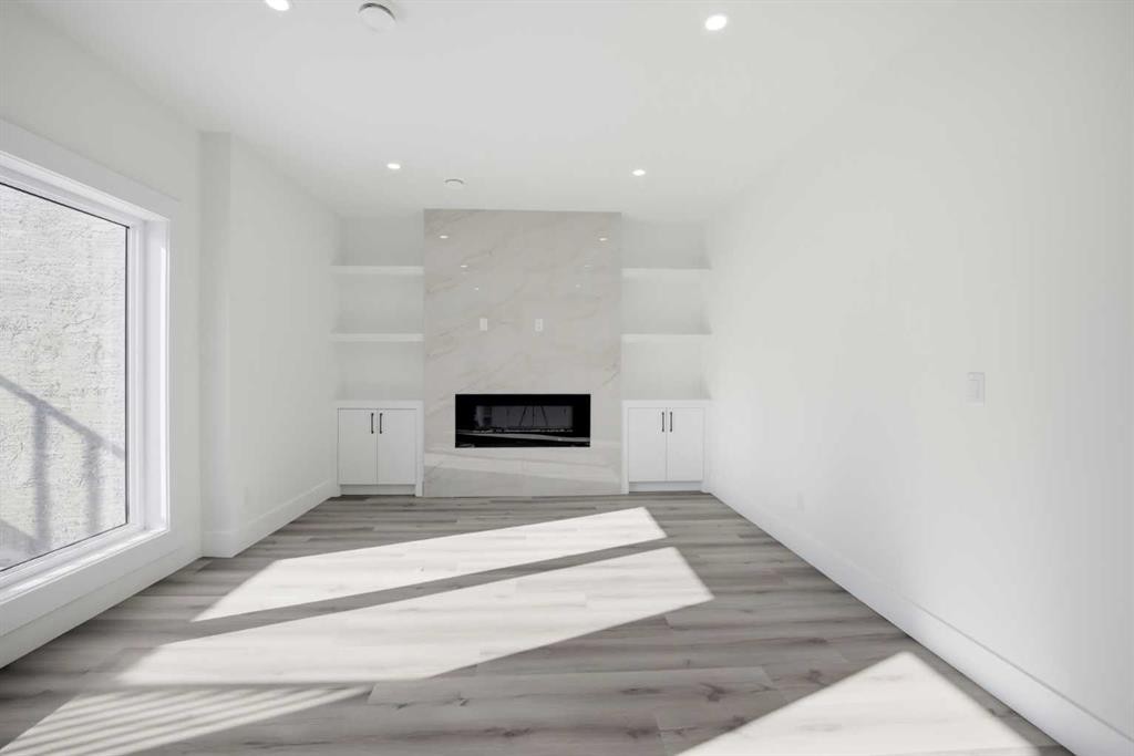 8520 33 Avenue Nw, Calgary, AB - Indoor Photo Showing Other Room With Fireplace