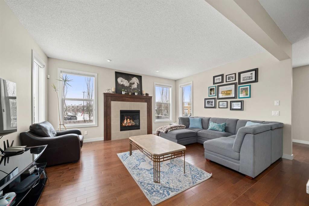 49 Evansview Manor Nw, Calgary, AB - Indoor Photo Showing Living Room With Fireplace